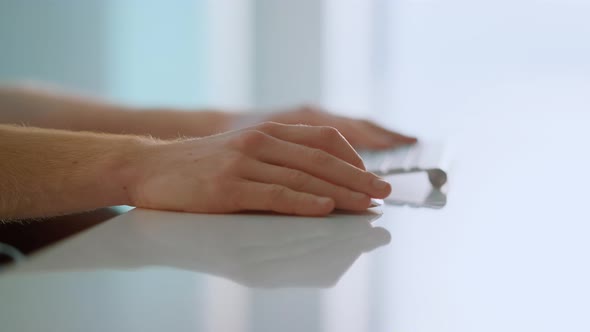 Worker Hands Holding Mouse Using Wireless Device at Bright Home Office Closeup