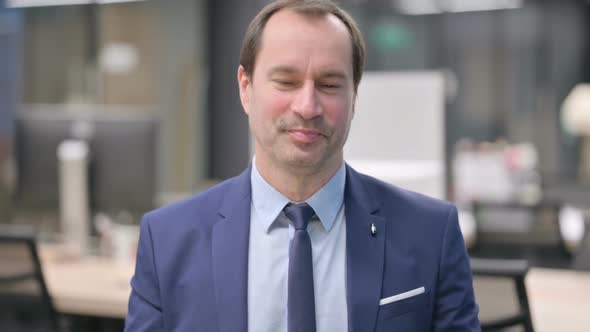 Portrait of Businessman Talking on Online Video Call