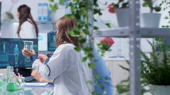 Senior Biologist Working with an Intern alt