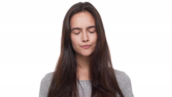 Portrait of Serious Confident Longhaired Woman Saying No Shaking Head in Denial Over White