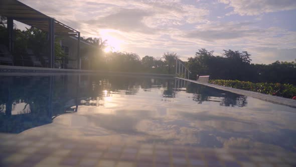 Luxurious view on swimming pool at sunset in nature environment, Boca, Chica, Panama. Slight movemen