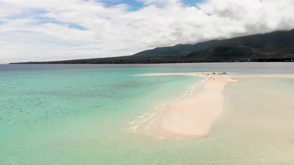 aerial drone shot over exotic island sand bar beach tropical paradise in Asia with tourist enjoying