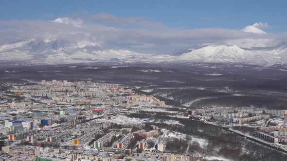 Winter Top View of Petropavlovsk City on Background Volcanoes