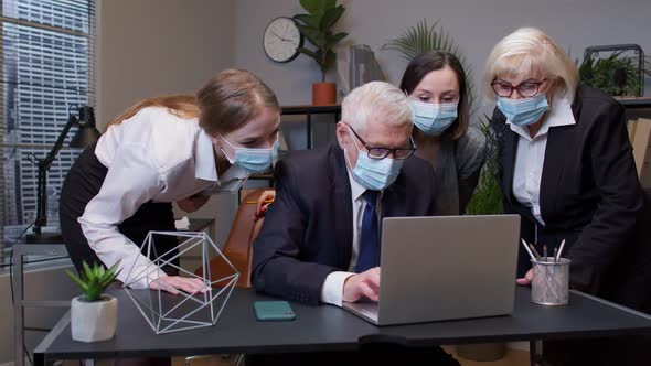 Group Business People Communicate Working with Laptop in Office in Masks During Coronavirus Pandemic