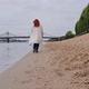 Young Woman is Walking Along City Beach - VideoHive Item for Sale