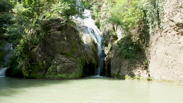 Slow Zoom in Shot of Beautiful Waterfalls in the Mountains