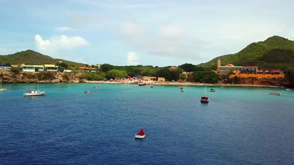 Aerial orbit of a small fishing boat off the shores of the beaches of Westpunt, Curacao, a Dutch Car