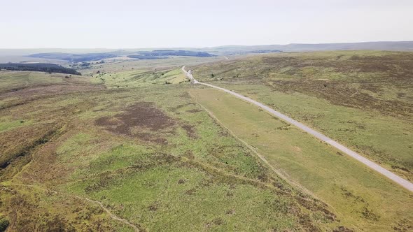Panoramic view of tors and hilltops in Dartmoor National Park, England.