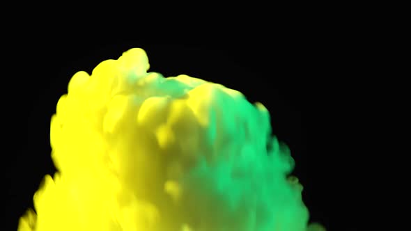 Yellow and Green Dry Ice in Glass on a Black Background with Copy Space