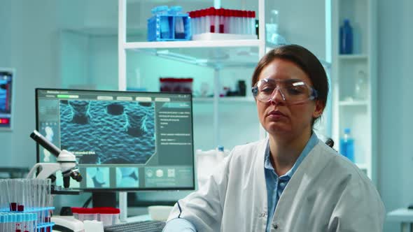 Portrait of Scientist Nurse Looking Exhausted at Camera