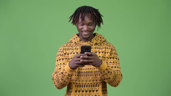 Young Happy African Man Using Phone