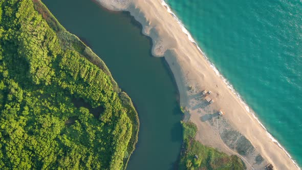 Exotic sandy beach surrounded by sea and river