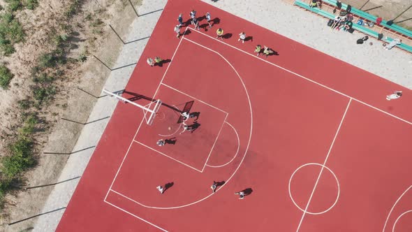 Aerial View of Teens Playing Basketball on an Outdoor Public Basketball Court