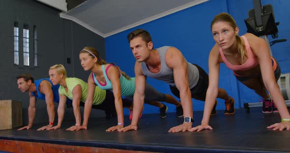 Group of people working out together in a row