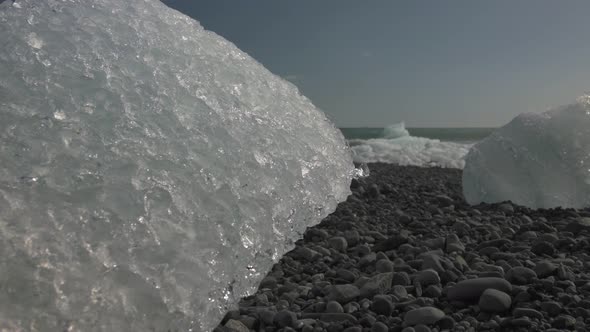 Slide from ice at the beach at the Jökulsárlón Glacier lagoon 