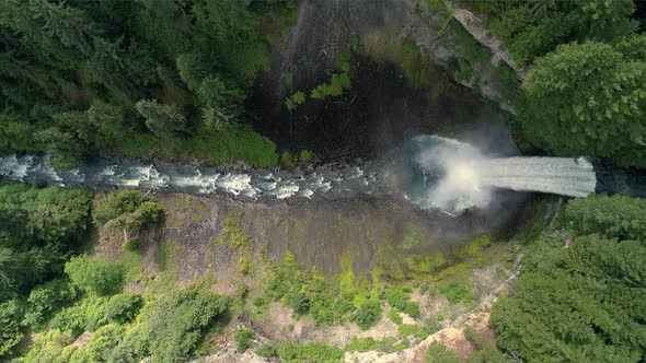 4K Helicopter Over Canyon Waterfall Into Crater In Canadian Wilderness 60P