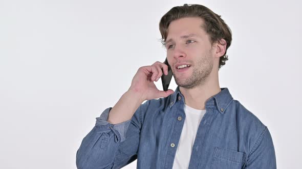 Portrait of Young Man Talking on Smartphone on White Background