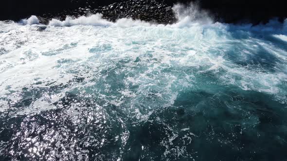 Drone footage of waves and a rocky beach at the Cap Mechant on the Reunion island.