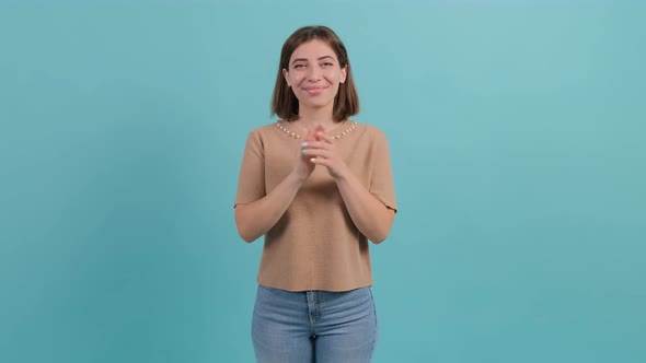 Applauding Young Pretty Girl, Clapping Over Turquoise Background.