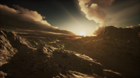 Sun Rays Over Mountains in a Valley