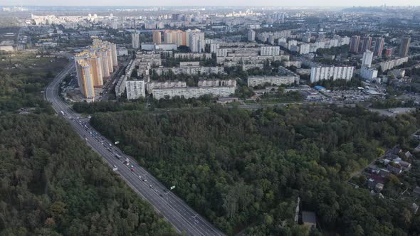 Megalopolis Next To the Forest: the Contact Between the Big City and Nature. Aerial View. Slow