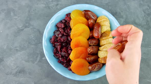 Dried cranberries apricots figs dates nuts bowl Healthy dry fruit berry snack breakfast nutritious