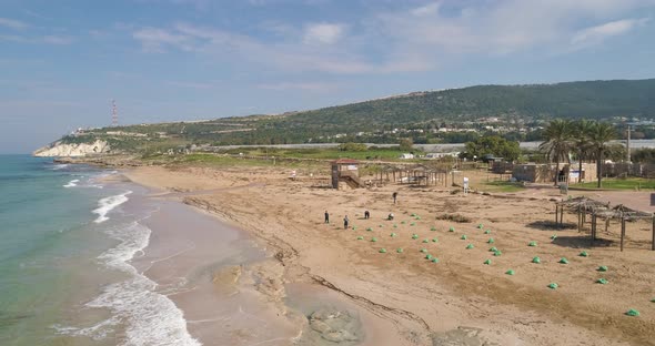 Aerial view of a beautiful coastline with beach in Acra, Israel.