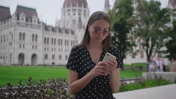 Girl with Mobile at Kossuth Square in Budapest Hungary