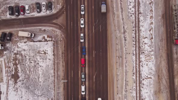 Aerial top view of crossroad intersection with busy urban traffic