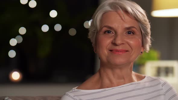 Portrait of Happy Senior Woman at Home in Evening