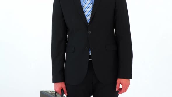 Portrait of businessman holding a briefcase