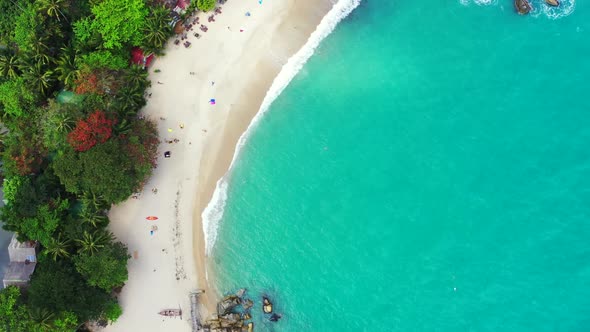 Aerial flying over seascape of beautiful sea view beach trip by blue water with white sand backgroun