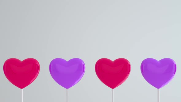 Purple pink hearts on white sticks on white isolated background