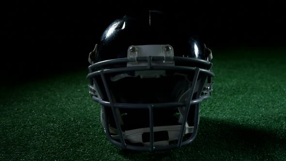 American football head gear on artificial turf