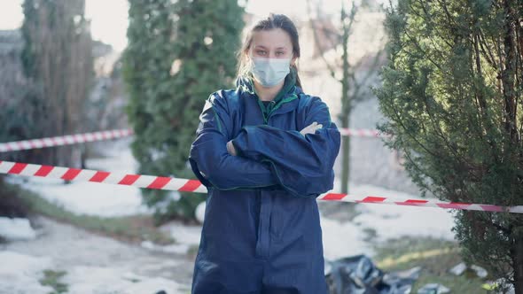 Medium Shot Portrait of Serious Confident Woman in Forensics Uniform Crossing Hands Looking at