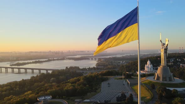 Ukrainian Flag in the Morning at Dawn. Aerial. Kyiv. Ukraine