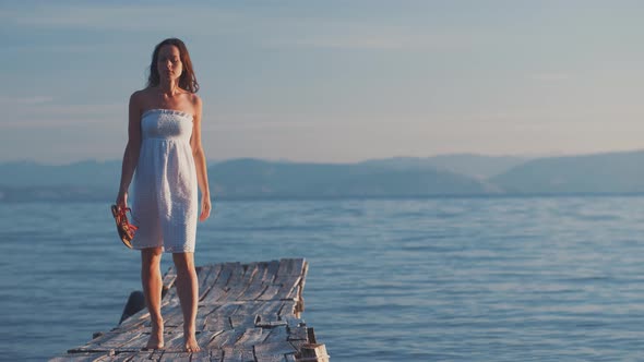 Attractive girl on the pier 