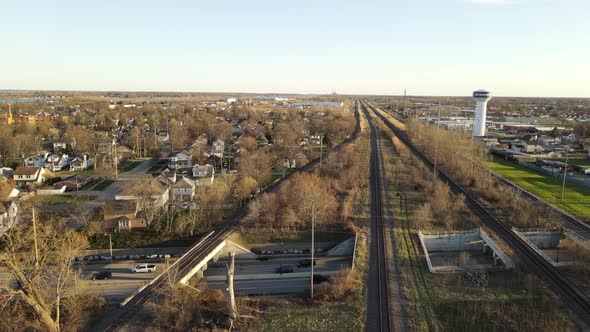Railroad tracks leading through small midwest town in USA, aerial view