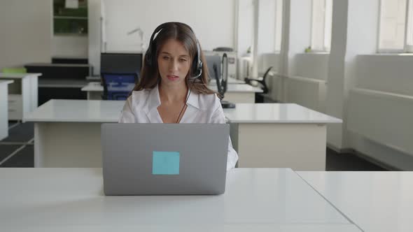 Lady Sits in Office and Does Her Online Work