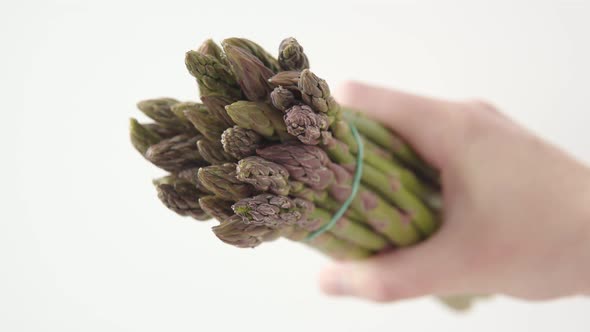 Green Asparagus on White Background Sliding Shot