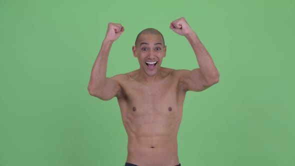 Happy Bald Multi Ethnic Shirtless Man Getting Good News