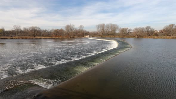 Water control dam on wide shallow river.