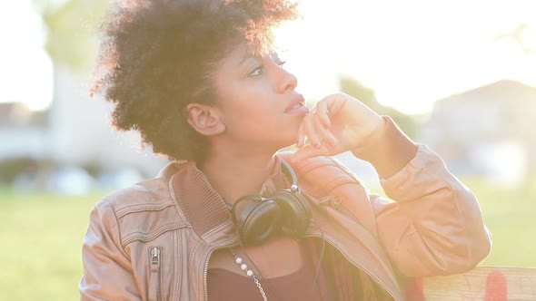 Young black woman outdoor looking over thinking future