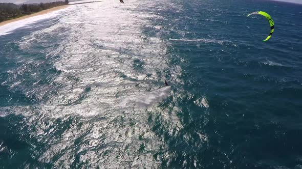 Aerial view of a man kitesurfing in Hawaii