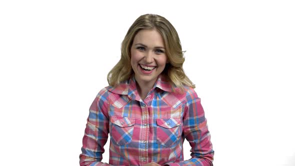 Young Delighted Woman is Laughing on White Background