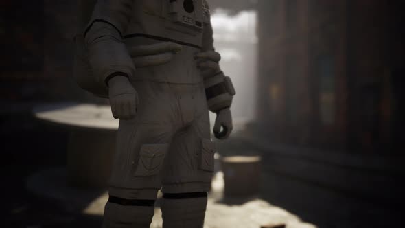 Lost Astronaut Near Abandoned Industrial Buildings of Old Factory alt