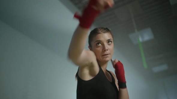 Female Fighter Trains His Punches Training in the Boxing Gym Female Trains a Series of Punches Fast