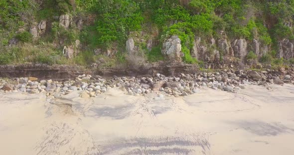 Spectacular aerial morning flight over beach and wild colorful ocean, Australia