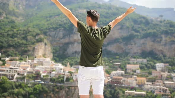 Summer Holiday in Italy. Young Man in Positano Village on the Background, Amalfi Coast, Italy