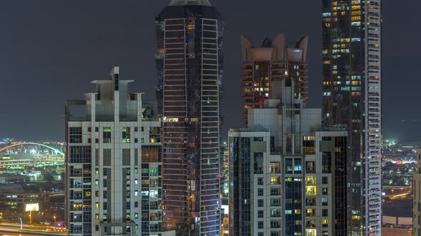 Nighttime View of Lights From Skyscrapers at Evening in Dubai Aerial Timelapse